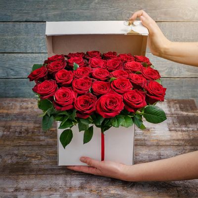 Firefly Show a photo of a 12 red roses in a box 17567.jpeg