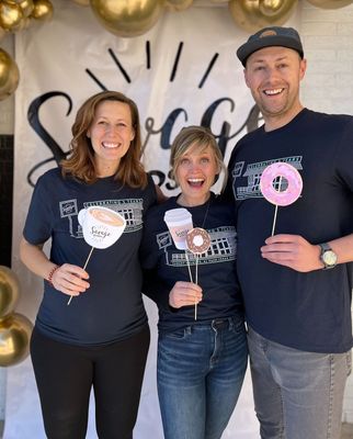 Michelle Savage (center), with her sister-in-law Mariah (left), and her husband Tyler (right).